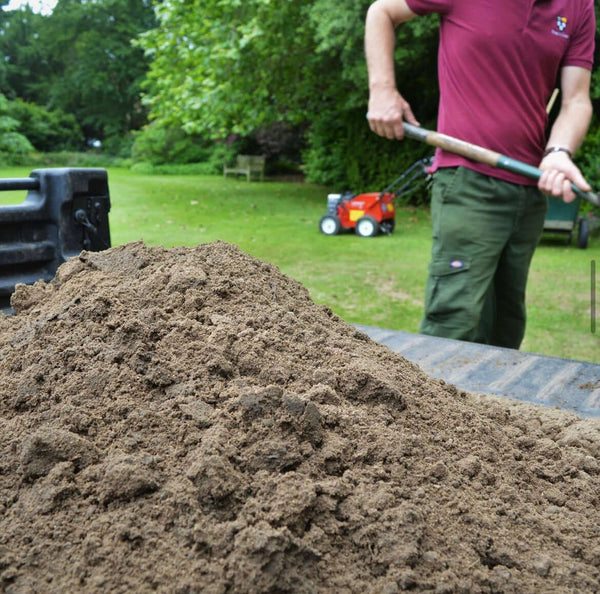 Top Dressing being spread onto lawn